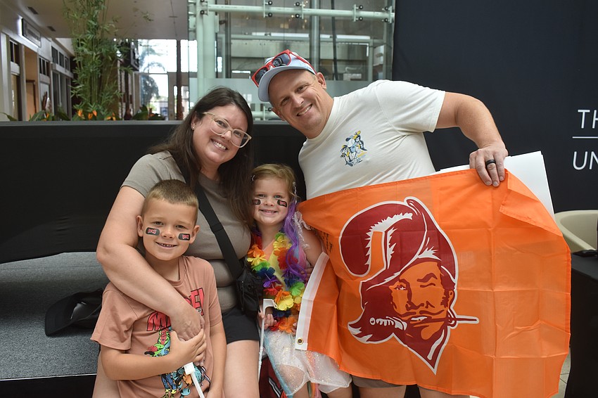 Buccaneers fans Lindsay and Casey brought their children Ryker, 6, and Hadley, 4, to meet Shelton Quarles.