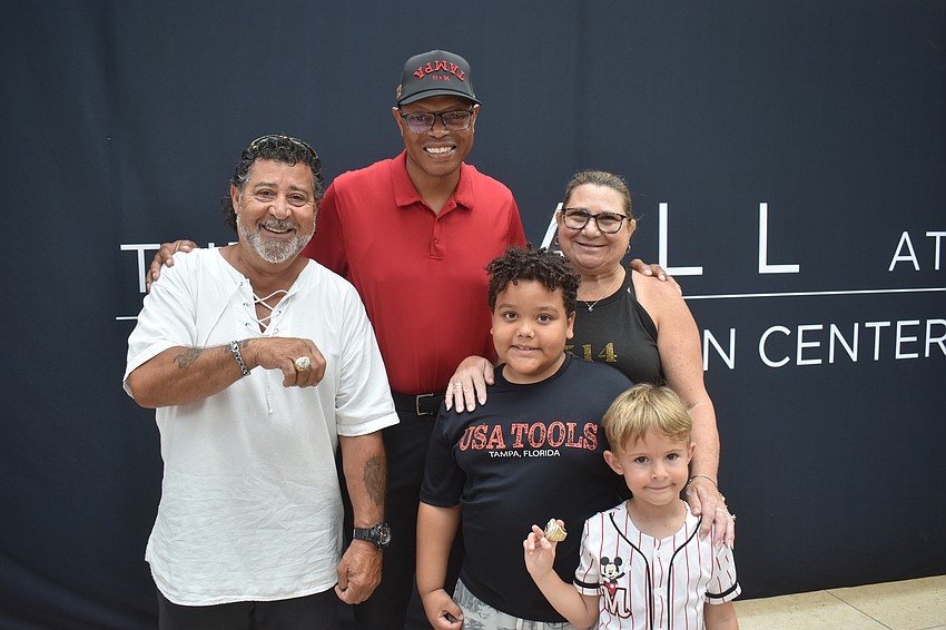 Lakewood Ranch residents Jose Pagan (left) and his wife Sheryl brought grandkids Elliot Baldwin, 8, and Maverick Pagan, 4, to meet Shelton Quarles. Baldwin is a big Buccaneers fan and plays football himself.