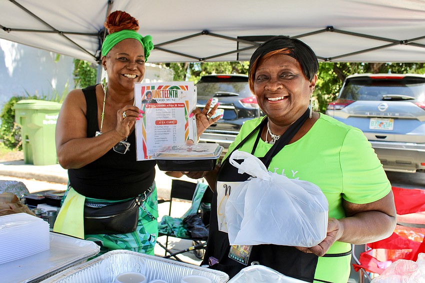 Eboni Rome and owner Natasha Milhouse run the NHome Taste of Soul booth at a Juneteenth festival on June 14.
