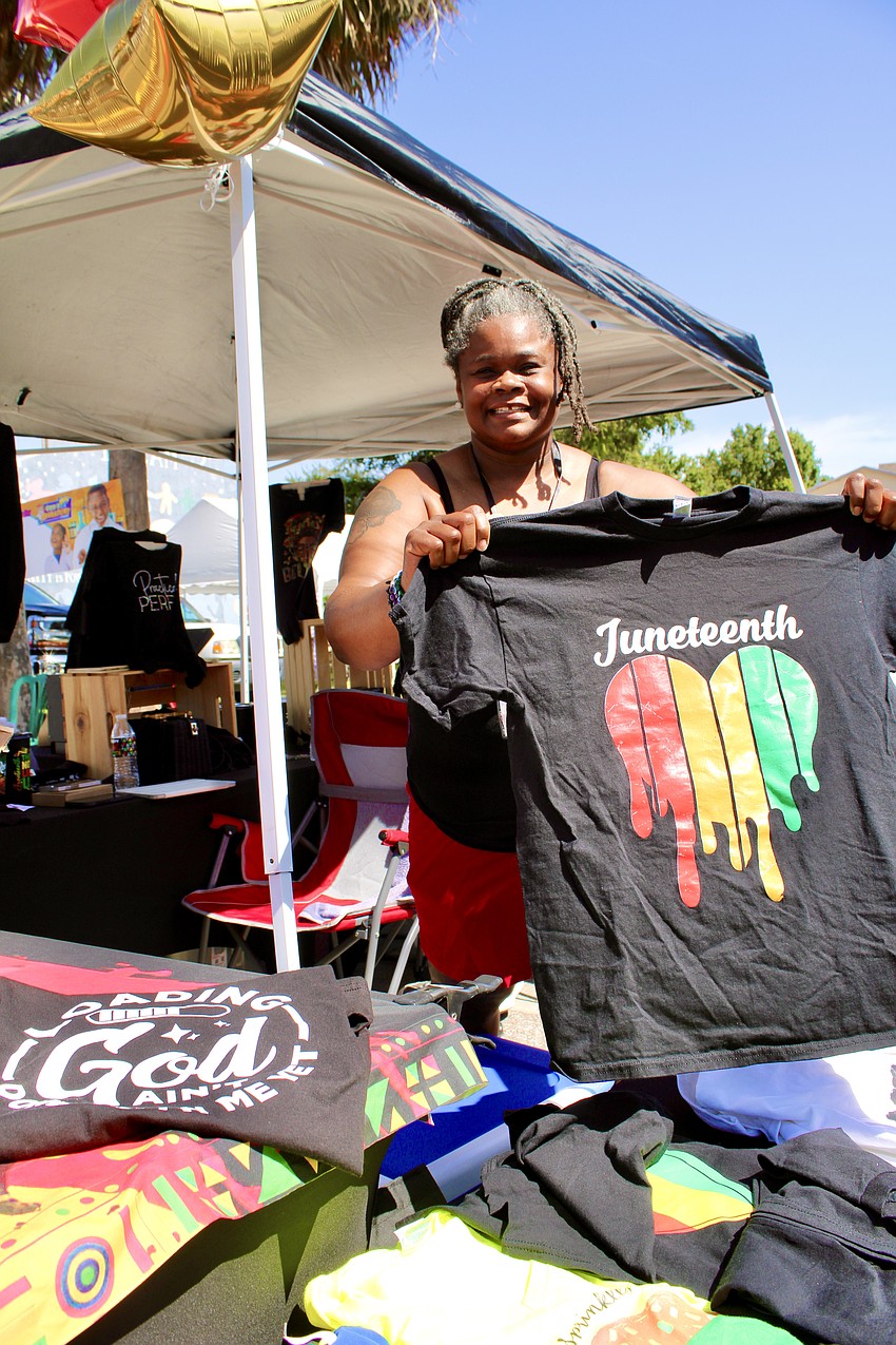 Latressa Preston runs New Media Graphics, featuring her T-shirts at the Juneteenth block party.