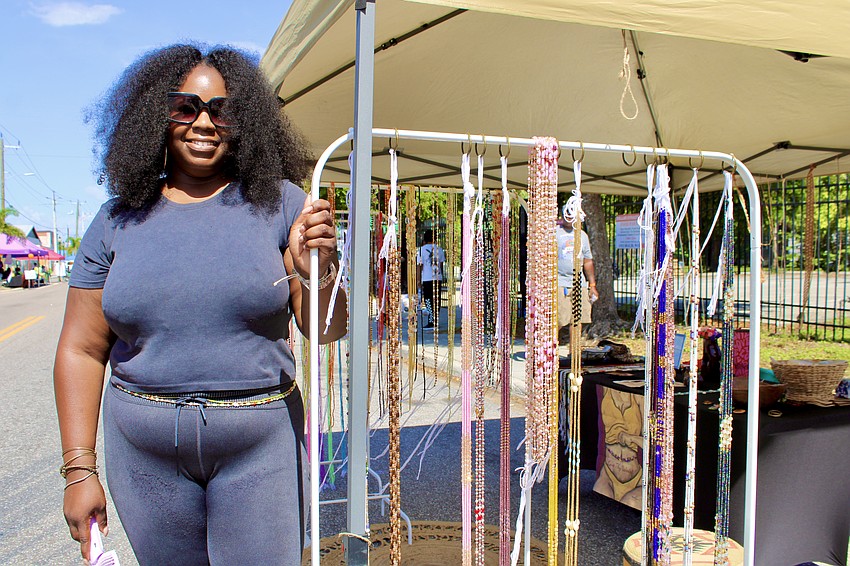 Nicole Hird of Love Thy Waistbeads shares her wares at the Juneteenth block party, featuring her own designs and those of entrepreneurs in Nigeria.
