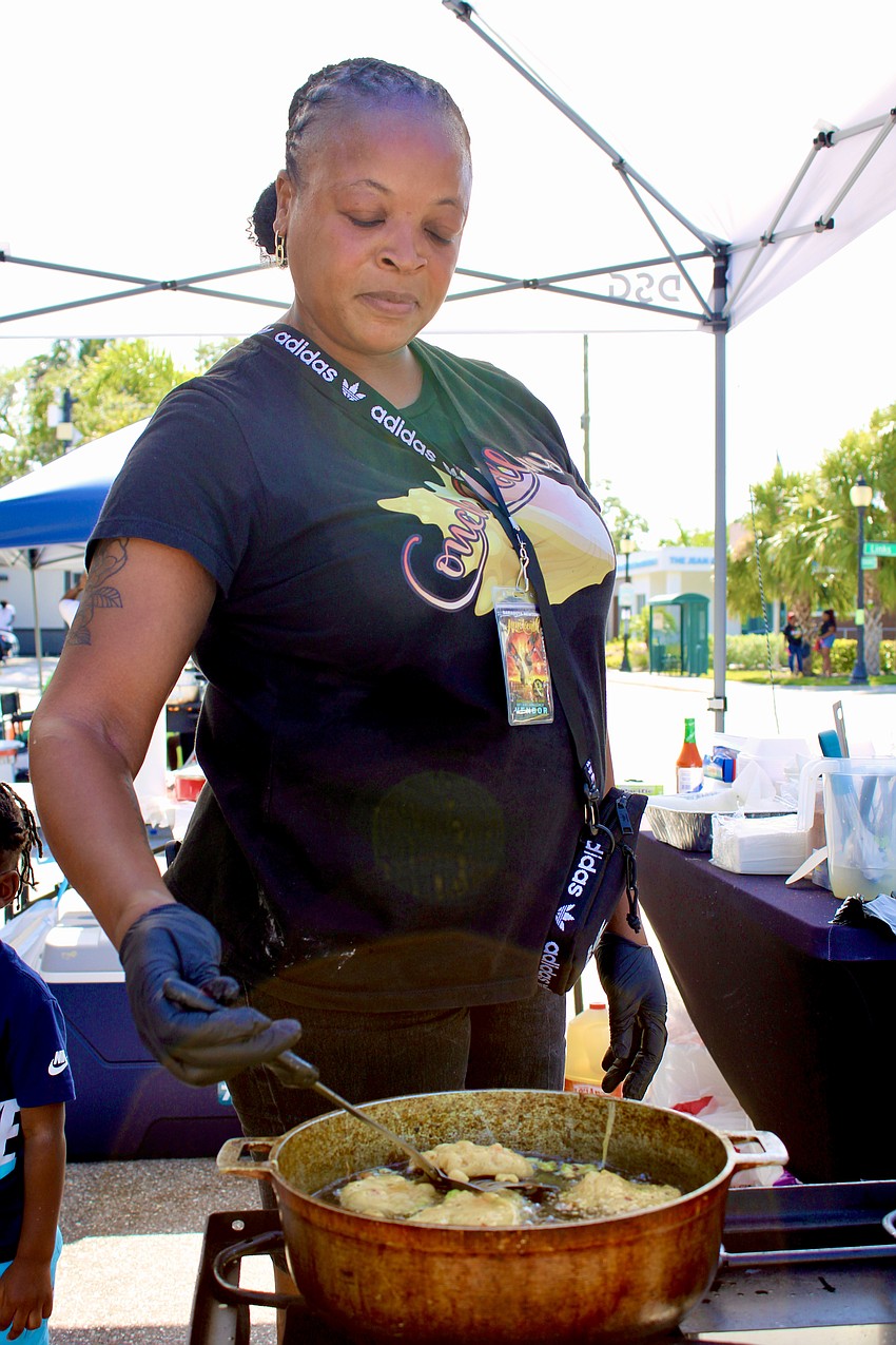 Conch Collins owner Tori Collins fries a fresh batch of conch fritters at the Juneteenth block party.
