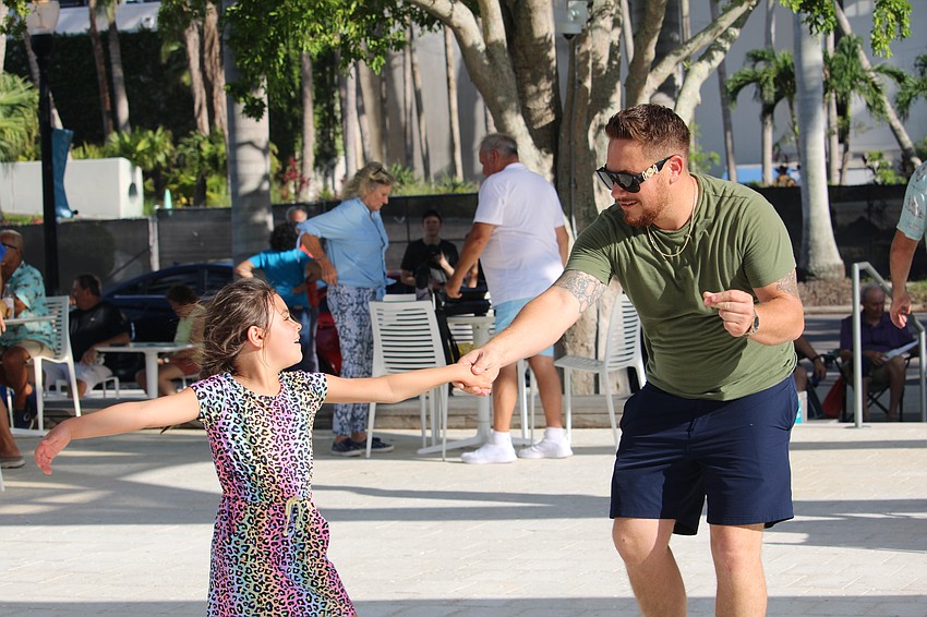 Jonathan Farthing and his daughter, Julianna, turn the top deck of The Oval into a dance floor as they celebrate Father's Day with a special Sundays at the Bay show.