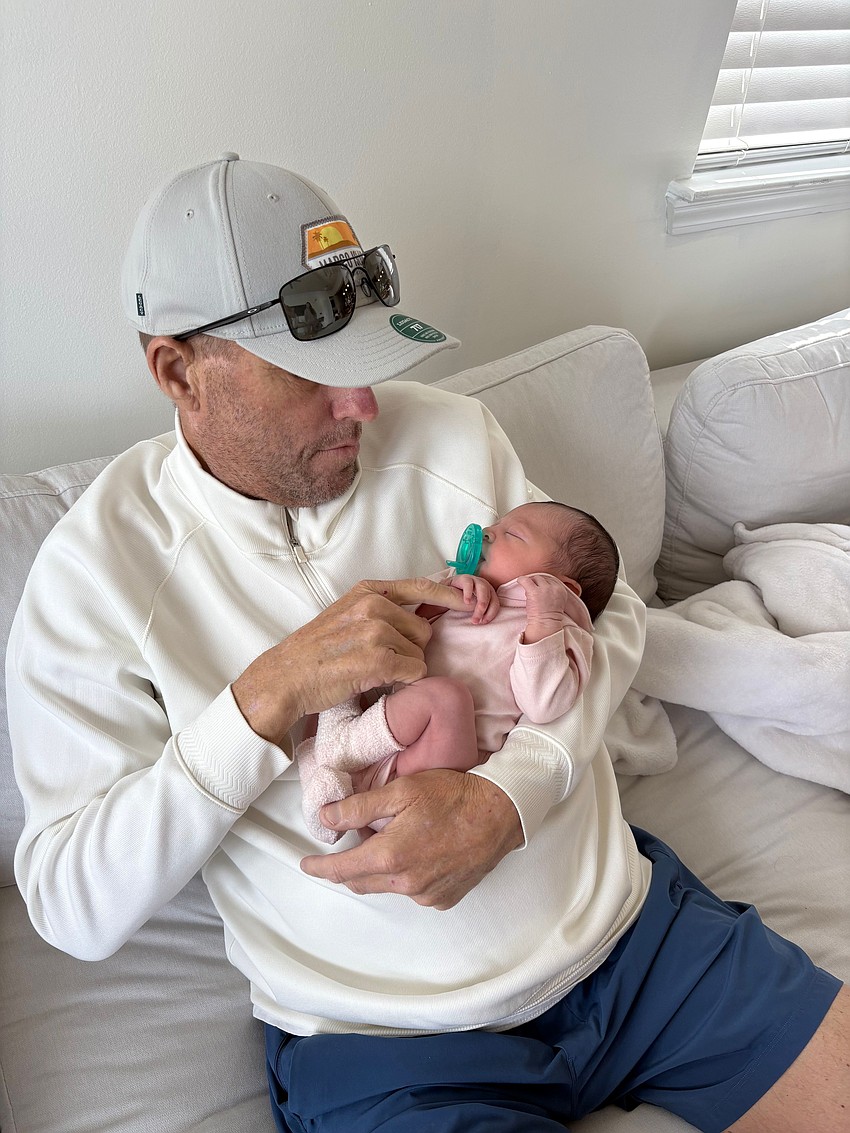 Andrew Wagner held his granddaughter, Isla Castillo, who was born in April.