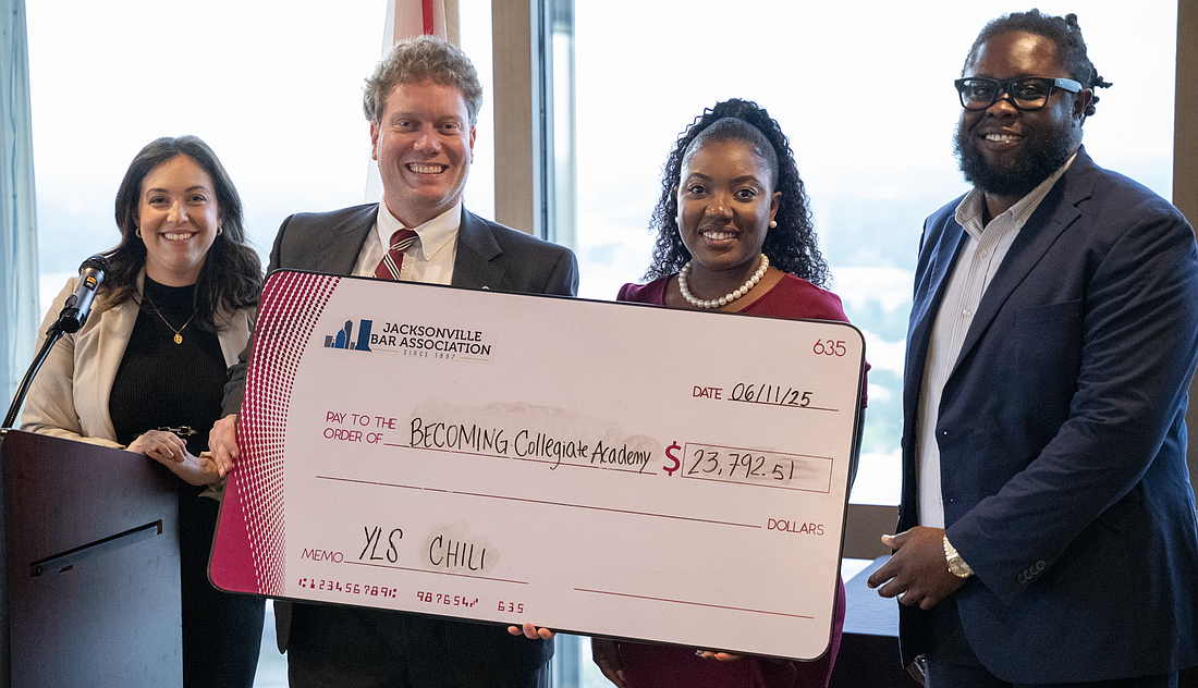 The Young Lawyers Section 2025 Chili Cook-off raised nearly $24,000 to benefit Becoming Collegiate Academy in North Jacksonville. From left, 2024-25 YLS President Kayla Haines Herrin; event Vice Chair Daniel O’Byrne; Shaneta Oliver, founding dean of operations at Becoming Collegiate Academy; and Cameron Frazier, founder and principal of Becoming Collegiate Academy.