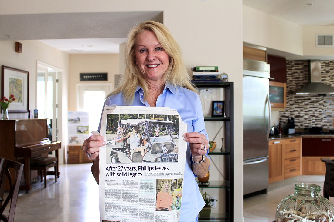Longboat Key resident Susan Phillips, pictured with a photo of her first time leading the Freedom Fest parade, returns this year as parade marshal.