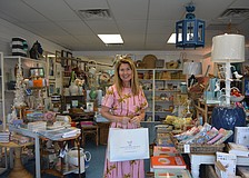 Heather Rippy, owner of Driftwood Beach Home and Garden poses after a successful first of the Season Summer Night Out.