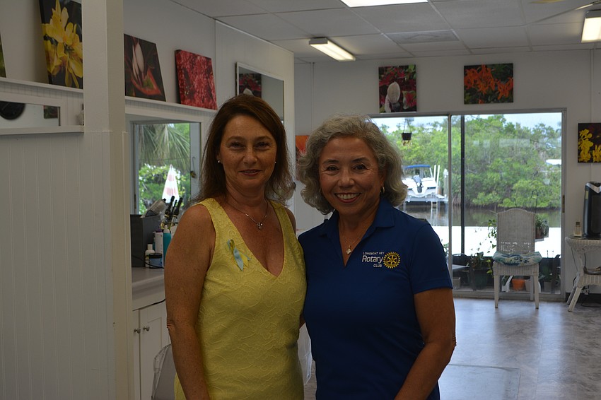 Irina LaRose co-owner of Design 2000 and Alzira Meierling member of the Rotary Club.