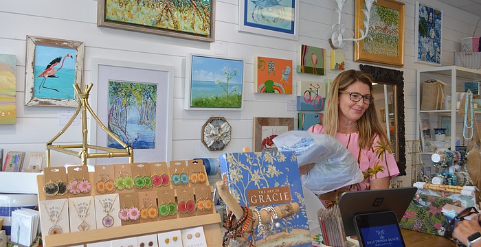 Owner Heather Rippy checking out a local customer at the Summer Night Out 2025.