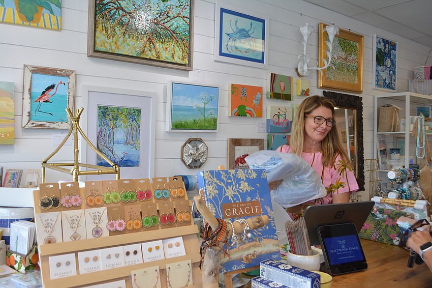 Owner Heather Rippy checking out a local customer at the Summer Night Out 2025.