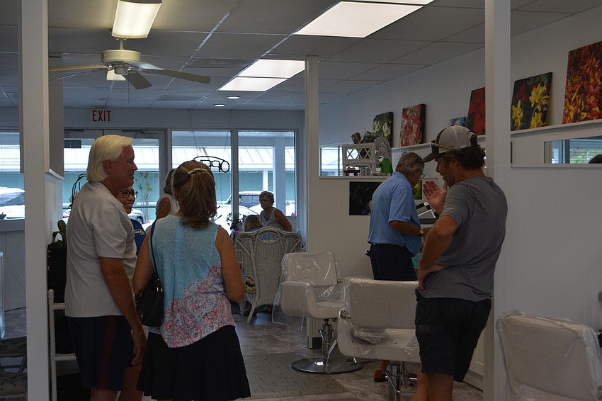 Residents catch-up over pizza from Ventura's Italian Kitchen and donuts from Elegant Lady.