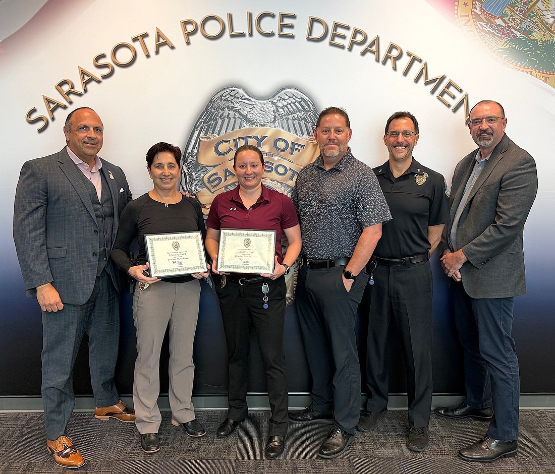 From left, SPD Chief Rex Troche Det. Maria Llovio, Det Jessica Sullivan, Sgt. Charlie Riffe, Deputy Chief Scott Mayforth and Capt. John Todd.
