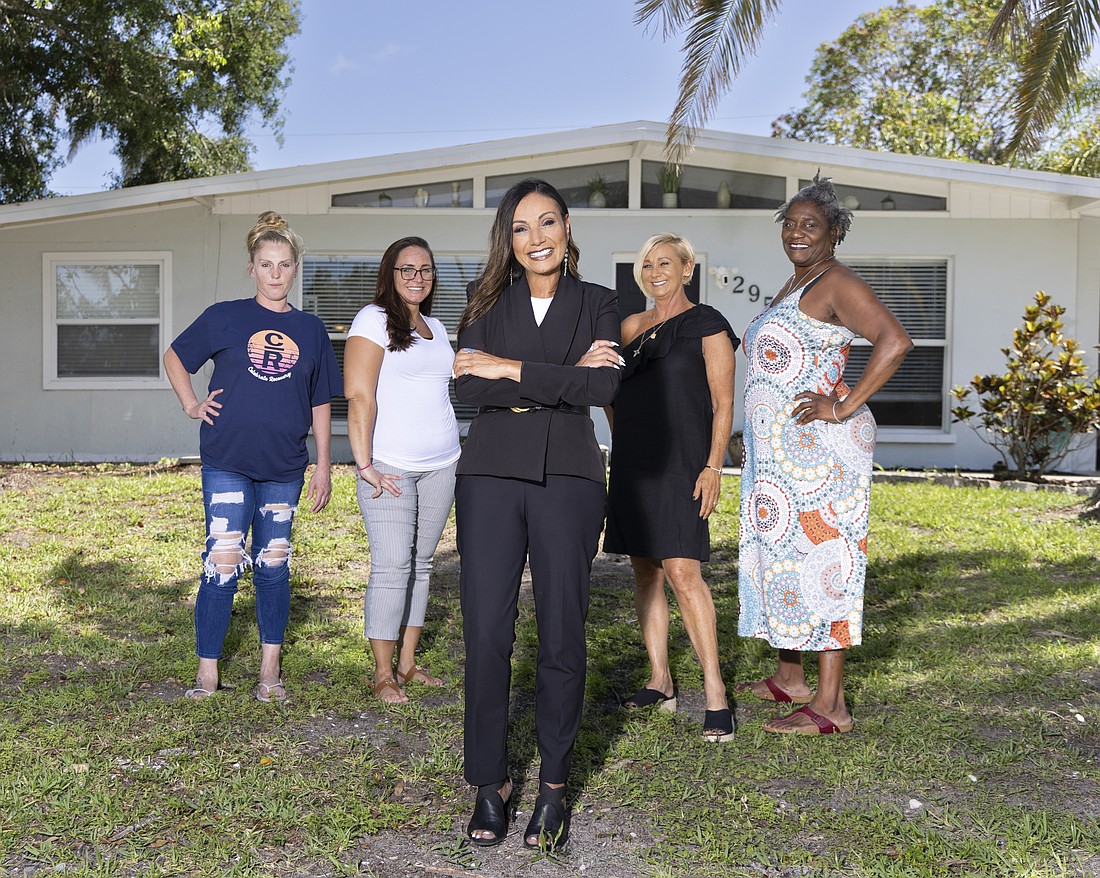 Alicia Gillis, Chelsea Dietrich, Kari Sears and Toni Lemieux, director of operations at Grace Recovery House, stand with the CEO, Miranda Monahan.