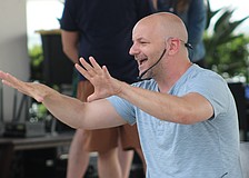 Lakewood Ranch's Kevin Allen connects with the crowd during the Florida Studio Theatre's improv show at Waterside Place June 20.