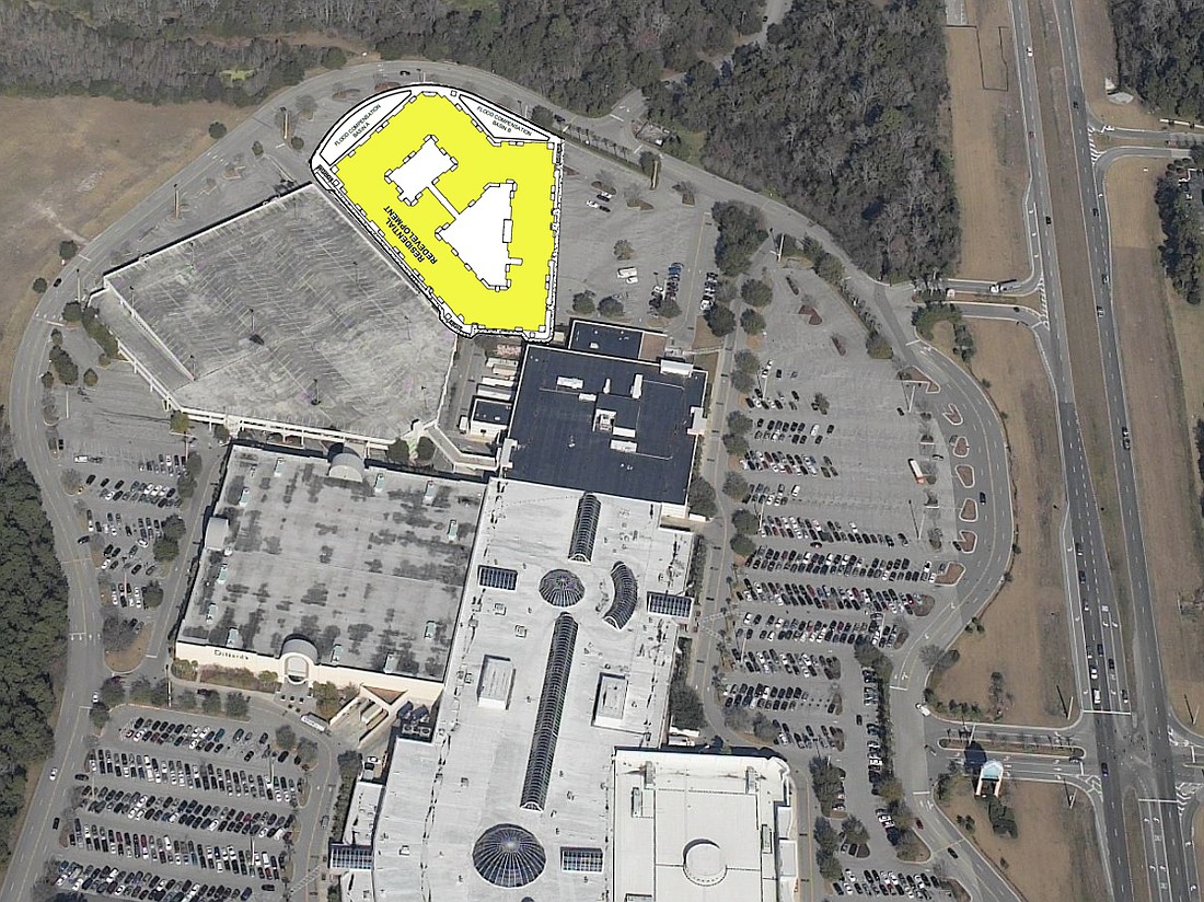 An apartment community is planned for a surface parking lot at the north end of The Avenues Mall.