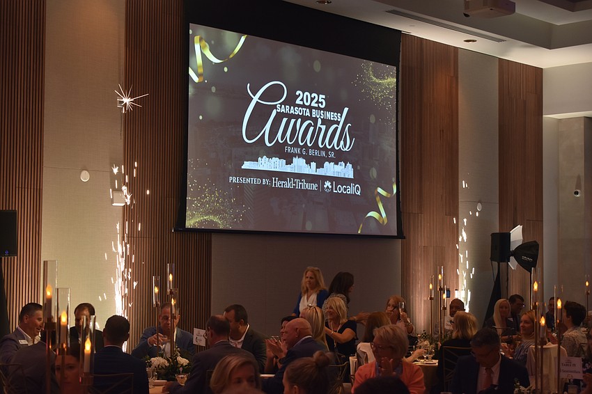 A pyrotechnic effect goes off as the ceremony commences.