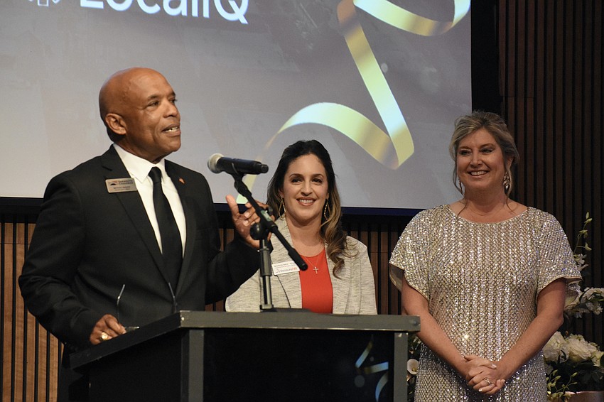 Marlon Brown, director of govenment affairs for the Chamber, Bianca Naughton, and Heather Kasten