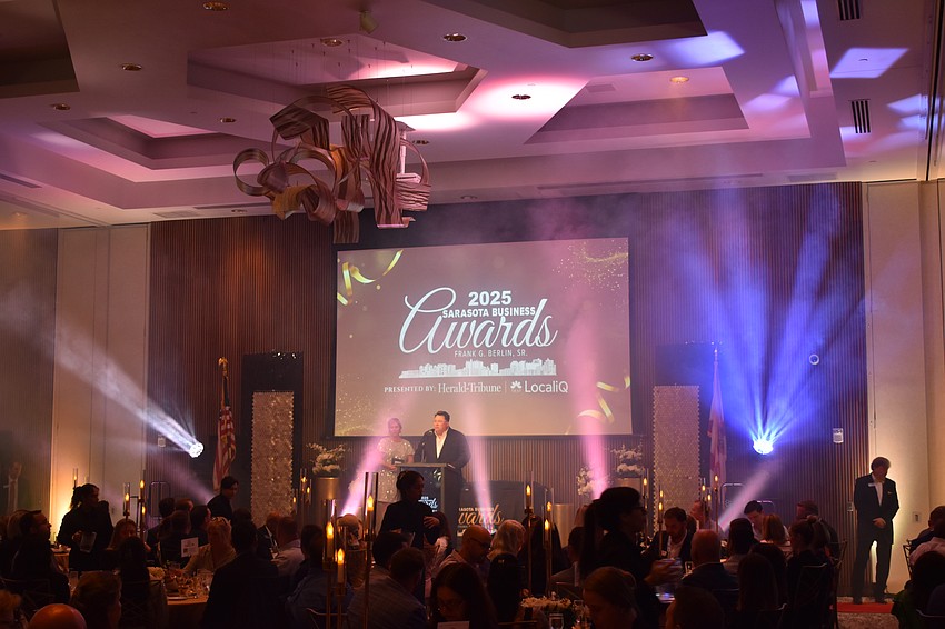 Heather Kasten and Daniel DeLeo at Shumaker, Loop & Kendrick address attendees.