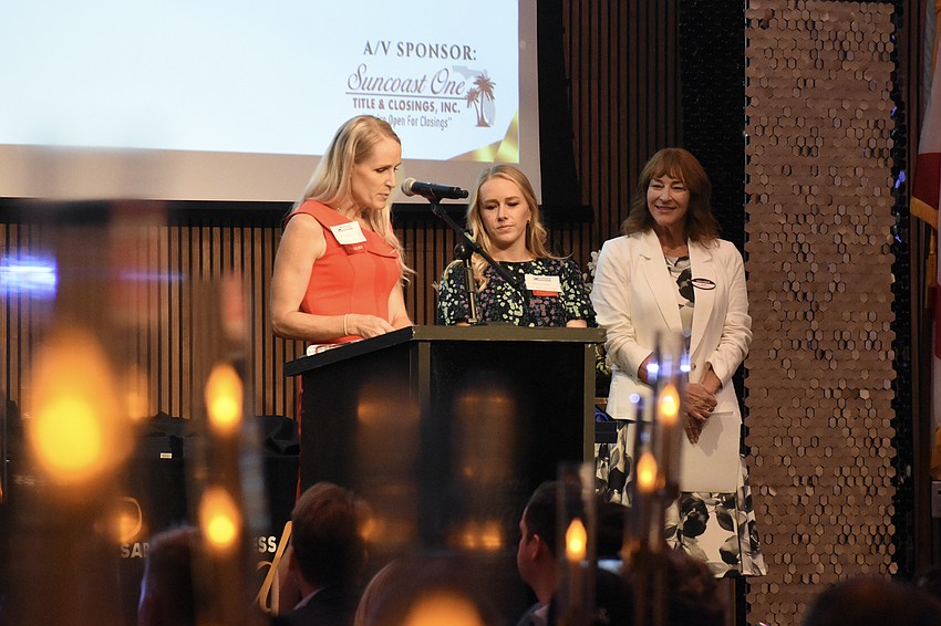 Dr. Kelly-Anne Shedd-Hartman and Dr. Jennifer Lichon claim the Medium Business of the Year award, presented by Janet Hazuda of MidFlorida Credit Union