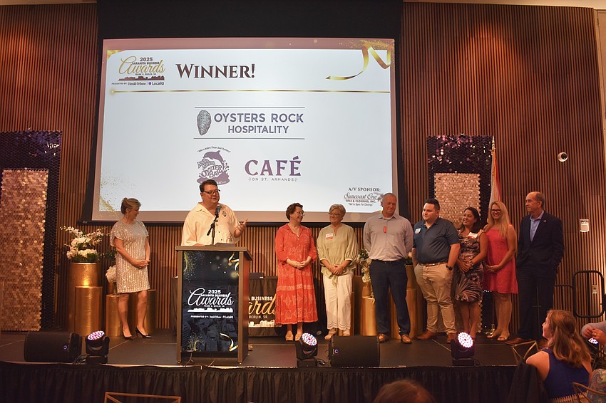 The team at Oysters Rock Hospitality claims the Hospitality Business of the Year award.