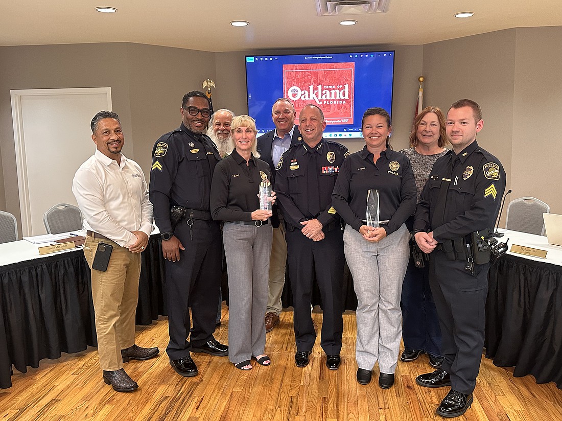 Commissioners and officers from Oakland were all smiles during the nighttime meeting on Tuesday, June 24.