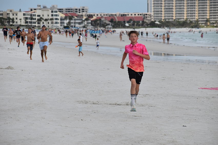 Nicolas Hamada, 13, leads the run.