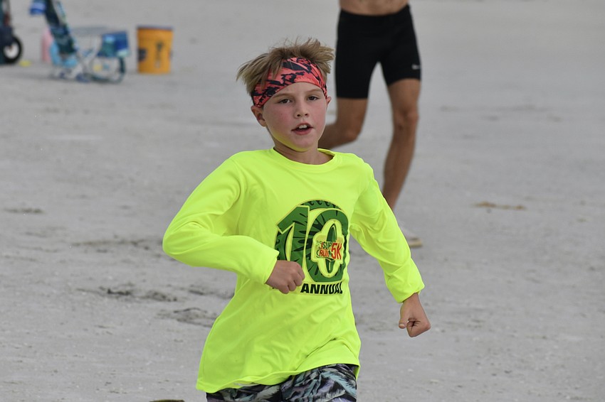William Owens, 8, makes his way across the beach.