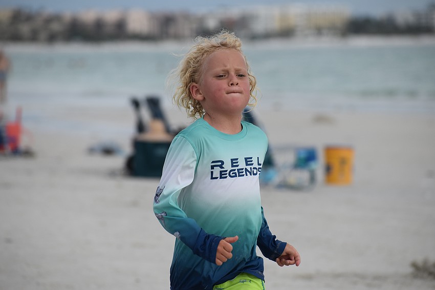 Bryce Arnold, 7, heads for the finish line.