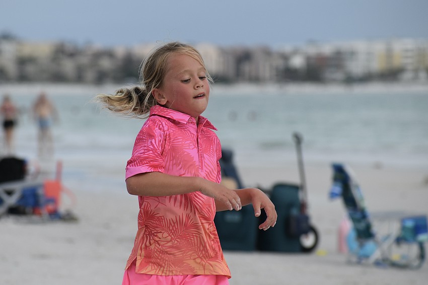 McKenzie Hamada, 7, heads for the finish line.