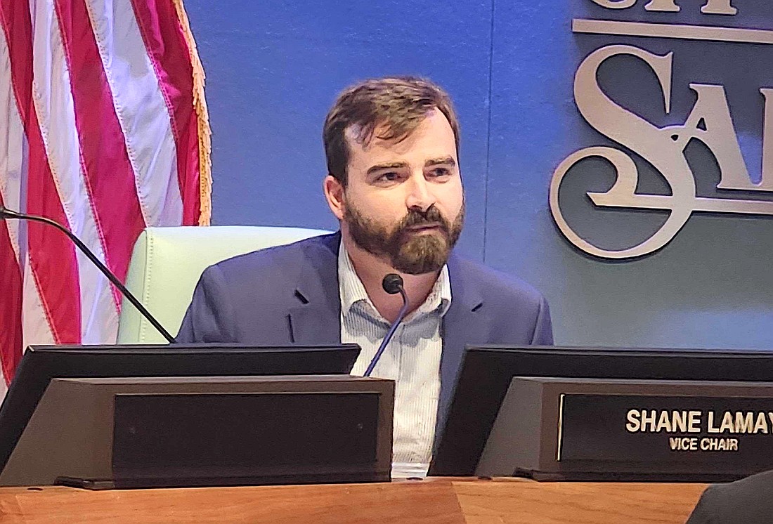 Planning Board member Shane Lamay asked if the medical office planned for University Parkway near SRQ could be moved to preserve trees.