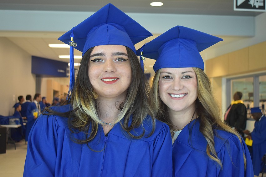 Hailey Lopez-Lanuza and Brittany Simunovic graduate from the surgical technolgy program. Lopez-Lanuza was a speaker at the commencement ceremony.