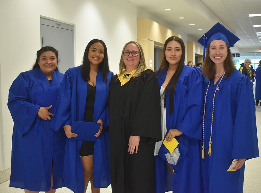 Karen Trejo, Isabella Garcia, dental assisting instructor Ashley Cestero, Ruby Jimenez-Carreon and Mikayla Wiles celebrate the students' graduation from the dental assisting technology and management program.