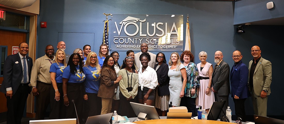 Damon Barrs, center, is appointed as assistant principal at Mainland by the School Board on Tuesday, June 24. Photo courtesy of Volusia County Schools/Facebook