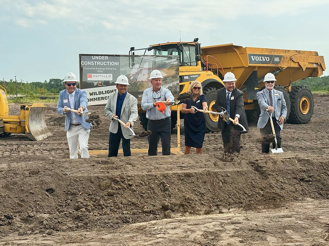 Officials take part in a groundbreaking June 25 for Wildlight Commerce Park in Yulee. At full build-out, the park is planned to be 12 buildings totaling 1.6 million square feet.