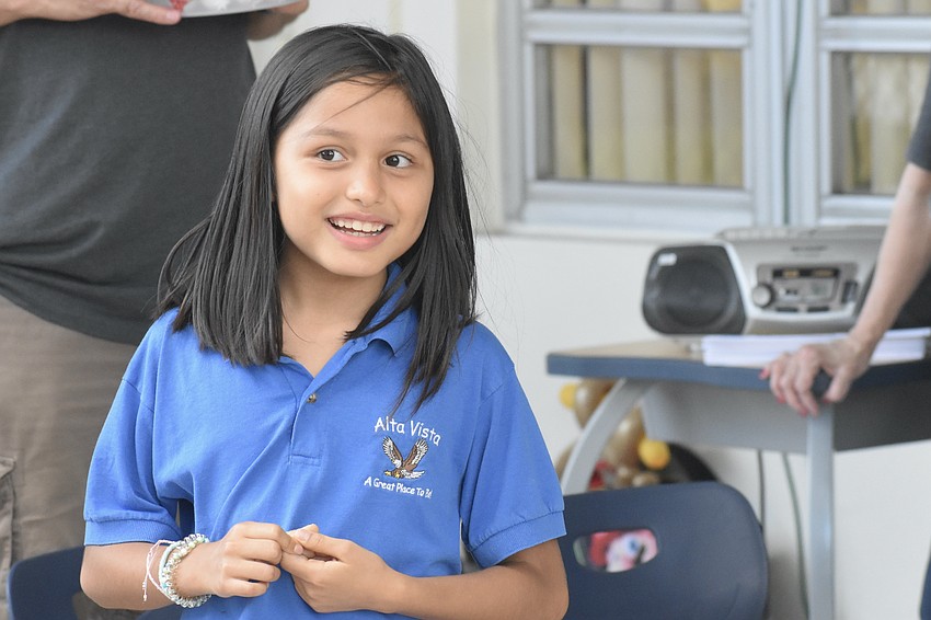 Ashley Barragan-Hoil, 8, plays musical chairs.