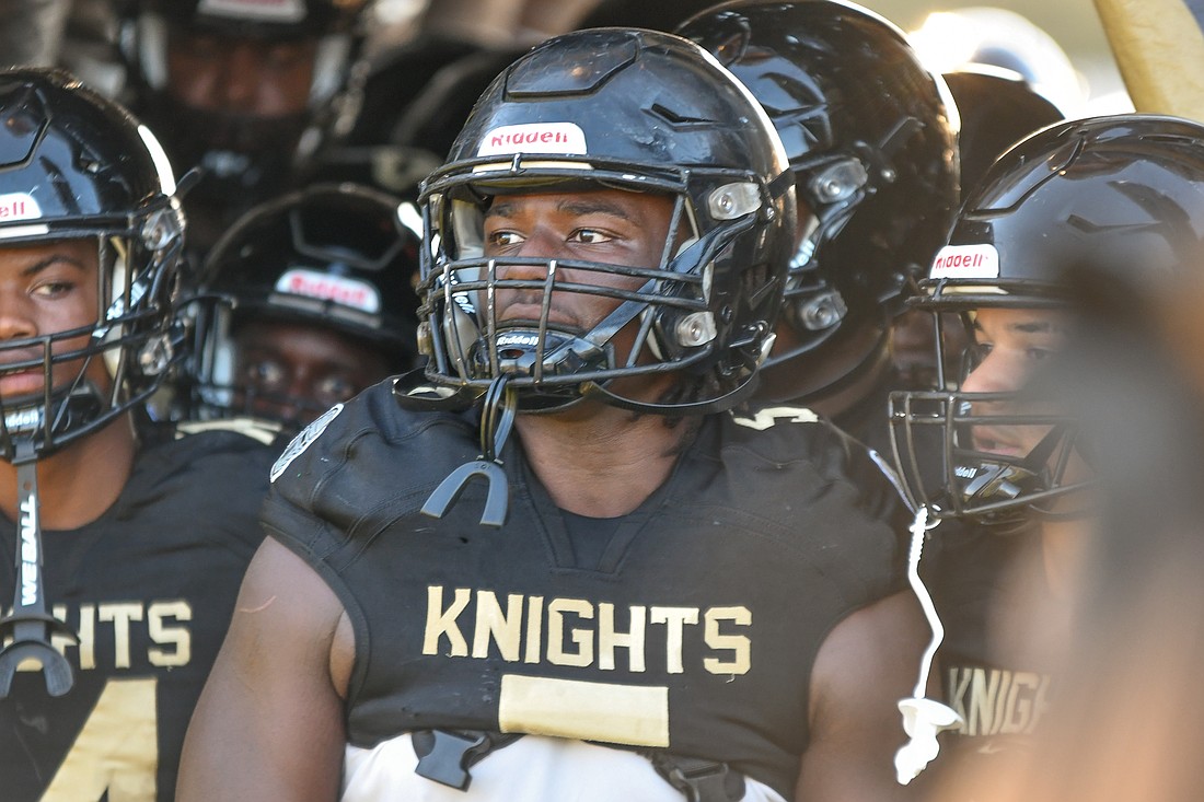 Ocoee football's Michael McClenton Jr. waited to lead the Knights out of the tunnel before their game against Olympia High.