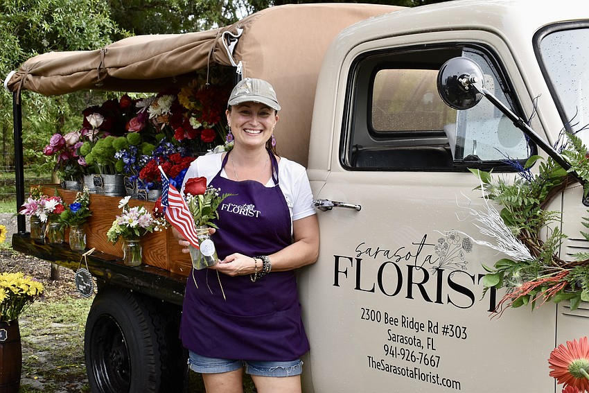 Stevie Krumm, owner of Sarasota FLorist, is selling single stems and bouquets at the event.