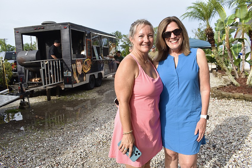 Sarasota's Carrie Santos and Twin Rivers Judy Young are enjoying the sunshine at the Red, White and Blueberry Celebration.