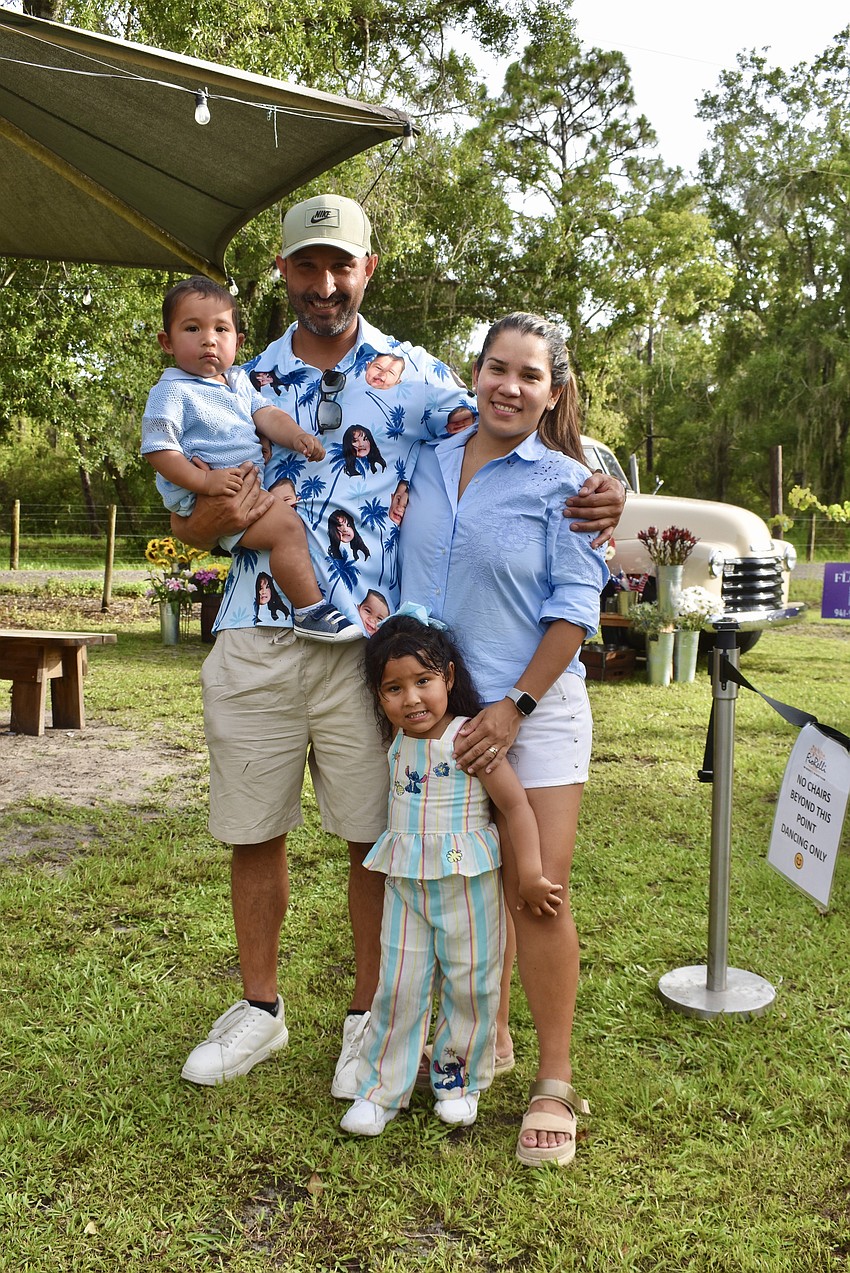 Bradenton's Herman and Oriana Armas Gil attend the Red, White and Blueberry celebration with their 1-year-old son Milan and 3-year-old daughter Aldana.