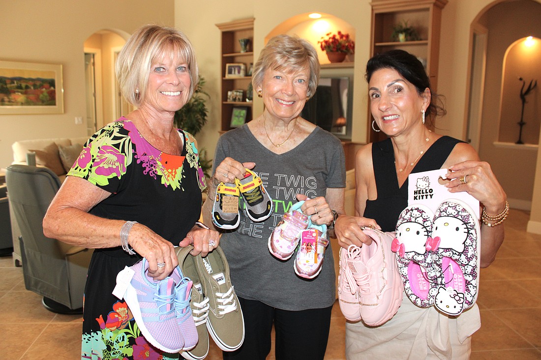 Cinda Krouk, Joy Stone and Barbara Najmy of the Lake Club Women's Giving Circle say they love helping foster kids through their sneaker drive.