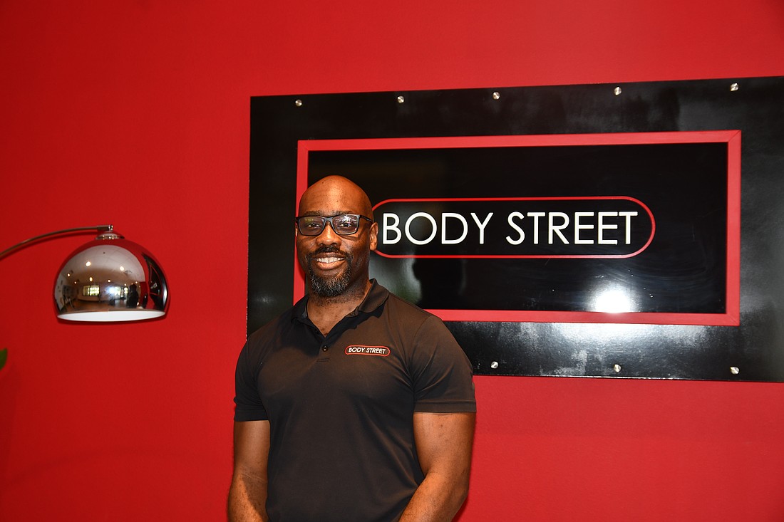 Andino Delve, manager and trainer at Body Street, is all smiles in the studio.