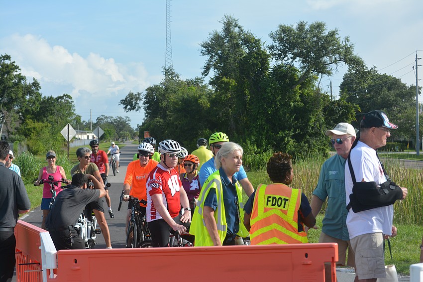 Members of the Friends of Legacy Trail all prepare for the opening of the new trail bridge.