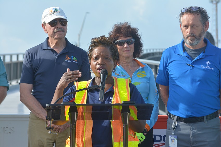 FDOT Public Information Director, Janella Newsome gives opening remarks for the opening of the New Legacy Trail Bridge.