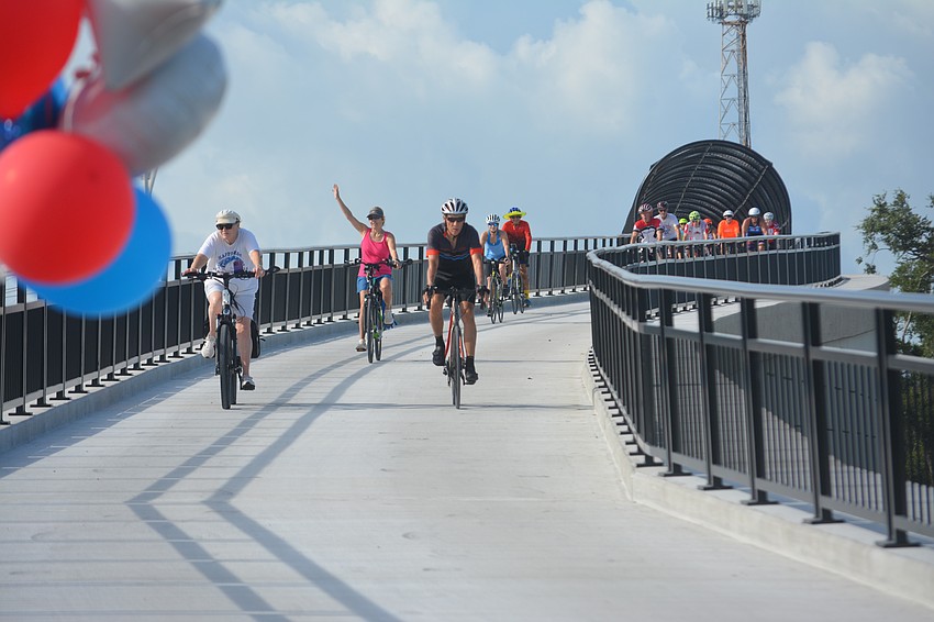 First few bikers of Friends of Legacy Trail to cross the new Legacy Trail bridge.