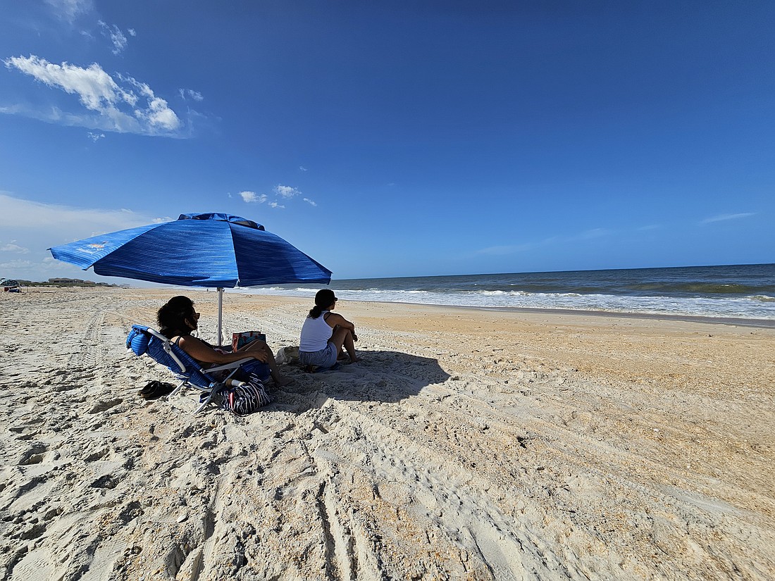 Flagler residents enjoy the surf at Mala Compra Park. Photo by Sierra Williams