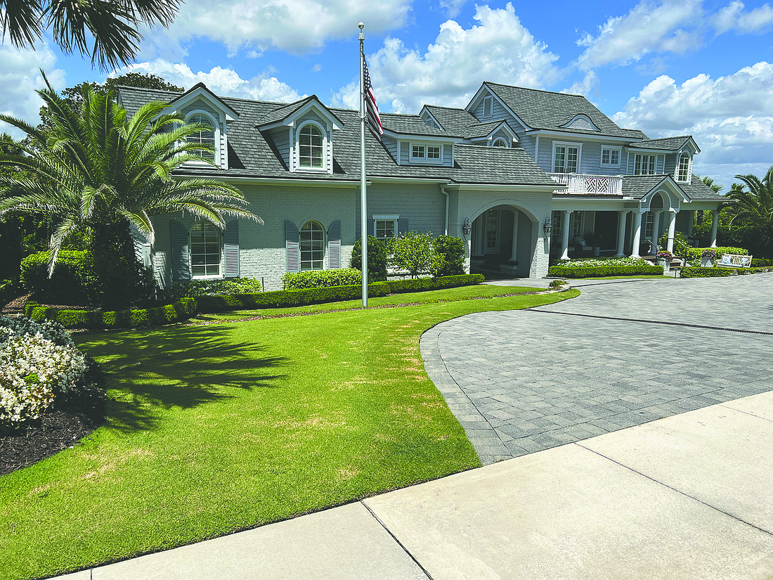 Across the street from the ocean, the home has five bedrooms, three full and one half baths, office, a three-car courtyard entry garage and a walk-in attic.