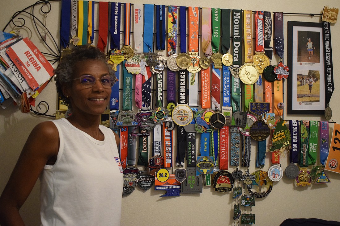Lakewood Ranch resident Regina Morris has kept medals and running bibs from each of the marathons she's run in all 50 states.