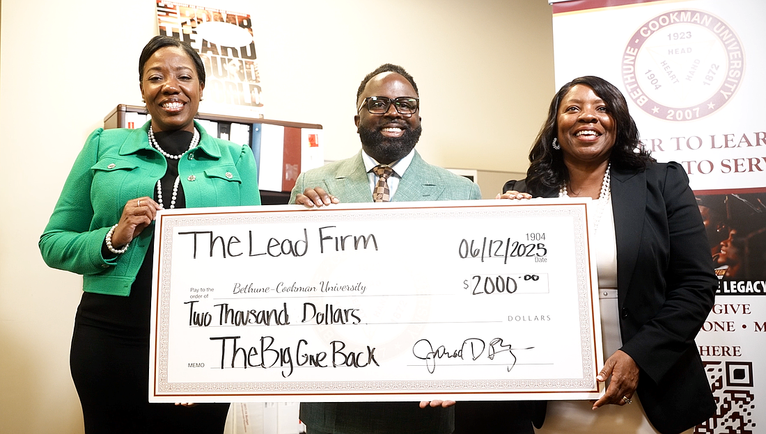 The Lead Firm presents a check for The Big Give Back. Courtesy photo