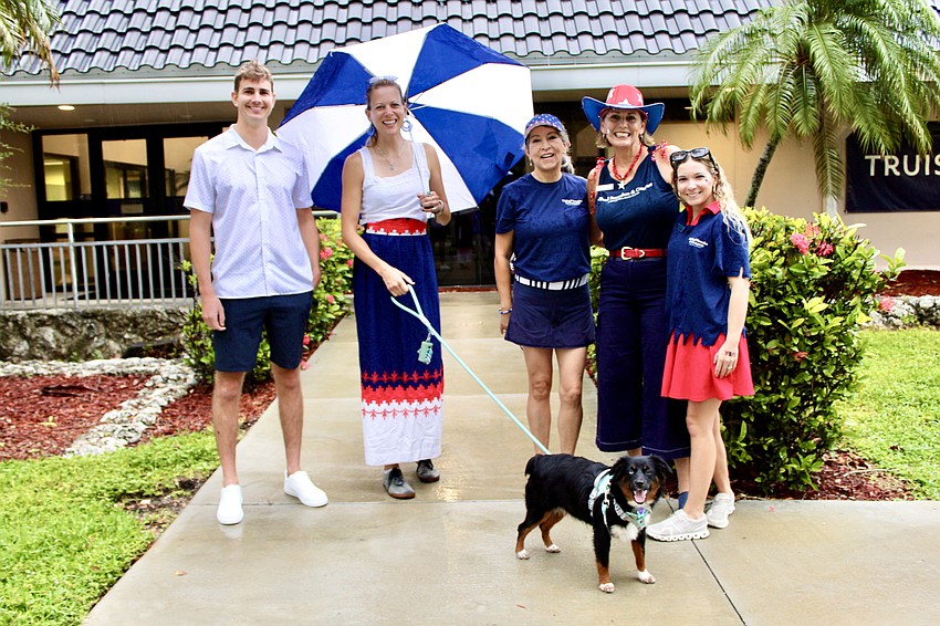 Charlie Metzler, Samantha Trotter, Mimi Kruk, JoDene Moneuse, Kelsie Rokicki and 6-month-old puppy Nova held out hope that Freedom Fest and other Fourth of July activities on Longboat Key would continue. However, lightning forced officials to cancel.