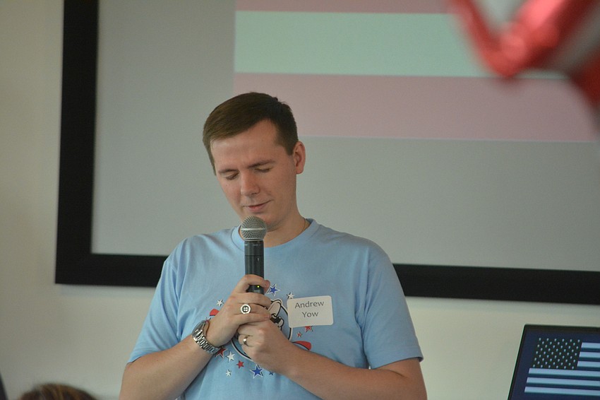 Rev. Andrew Yow leads the Fourth of July celebration in prayer.